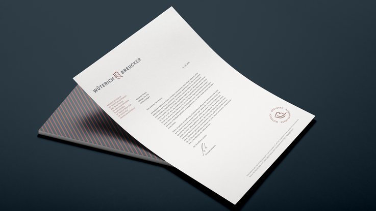 VISUELL Kommunikationsdesign: Corporate Design: Der Briefbogen mit grafischer Rückseite aus bronzefarbenen Linien auf dunkelblauem Grund