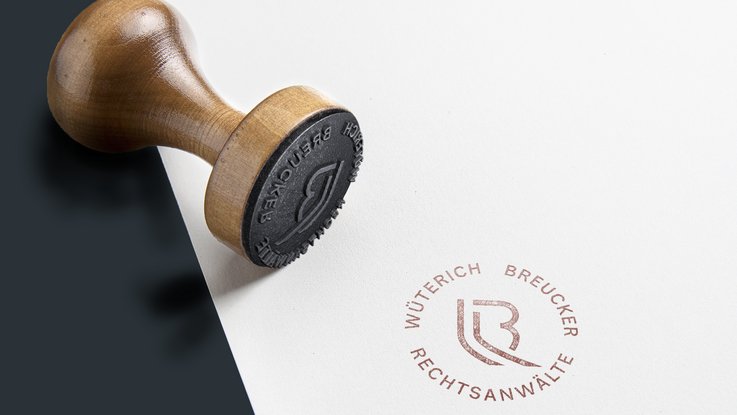 VISUELL Kommunikationsdesign: Corporate Design: Das Signet als Stempel mit kreisförmiger Anordnung der Bezeichnung Wüterich Breucker Rechtsanwälte 
